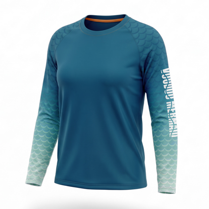 A long-sleeve athletic shirt in teal blue with a scale pattern fading into light aqua on the sleeves, featuring white vertical text on the right sleeve that reads 'MERCURY FISHING' and a small orange accent inside the collar, shown on a white background with a soft shadow.